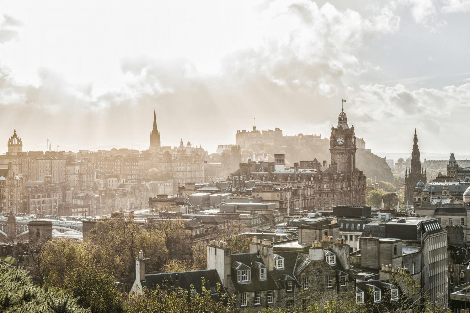 Ariel city view over a Scottish city with early morning light