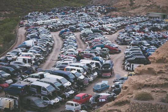 Scrap vehicles lined up in a scrapyard