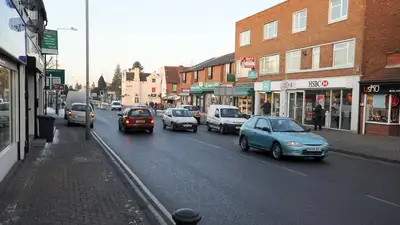 Busy high street with cars and traffic in Kingswinford