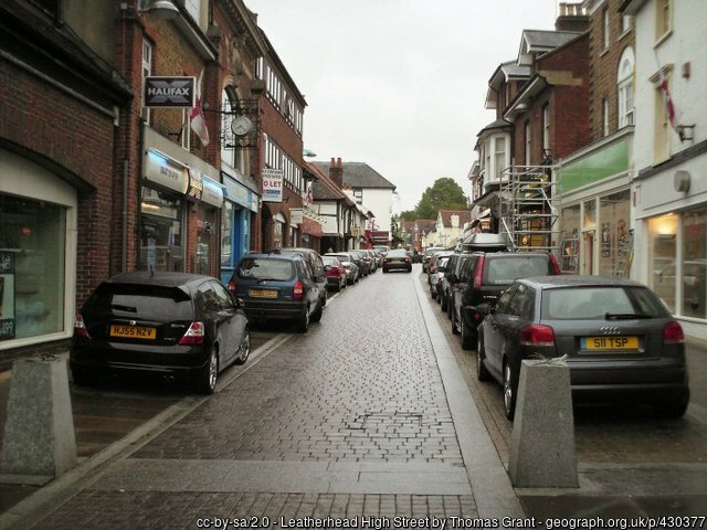 A street in Leatherhead, Surrey lined with parked cars