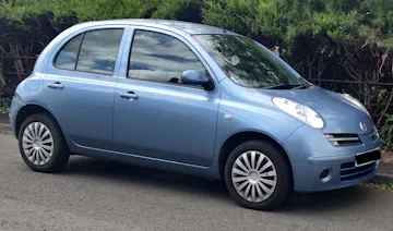 Blue coloured 2007 Nissan Micra parked on the road