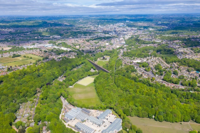 Aerial photo of the town of Huddersfield, showing the main town centre on a sunny day in the summer time in the Borough of Kirklees, in West Yorkshire, England
