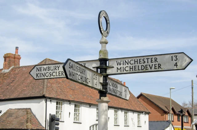 Road sign in Hampshire, showing Newbury, Kingsclere, Salisbury, Whitchurch, Winchester, Micheldever, Basingstoke and London