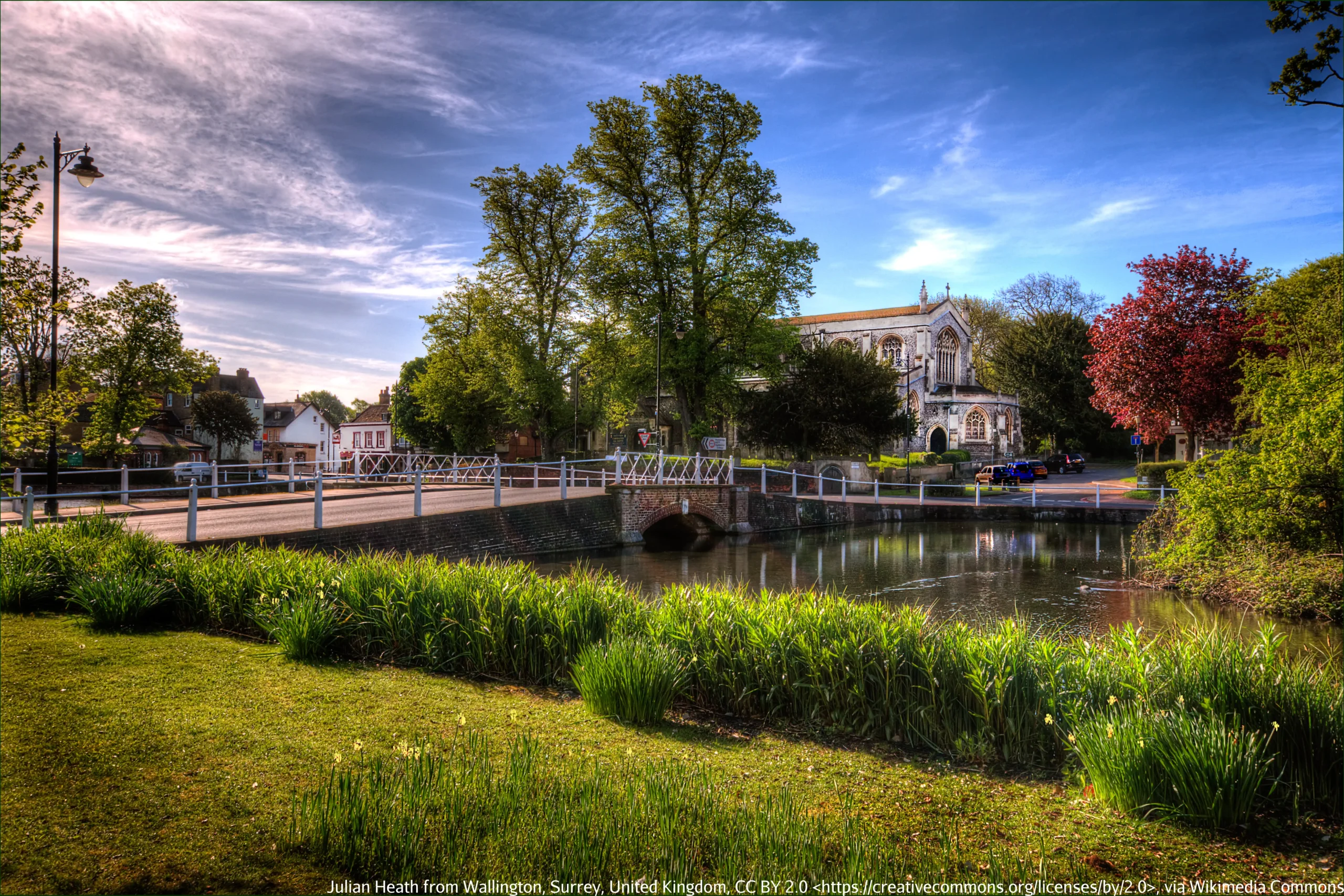 Bridge over a river with a church in the background, Carshalton