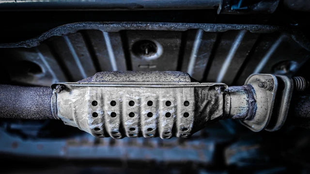 A catalytic converter seen below a car